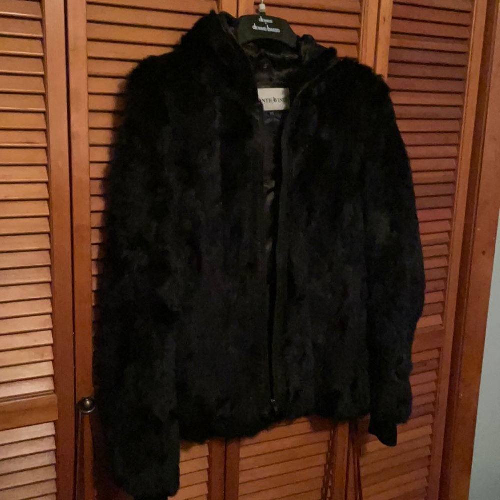 This is a fur black jacket. Gently warn.